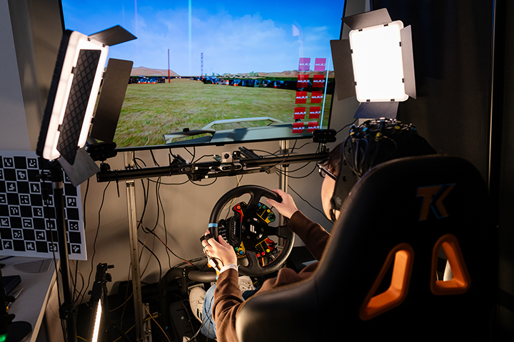Photo Credit: Melanie Reyes Photography Man driving simulation showing digital engineering.
