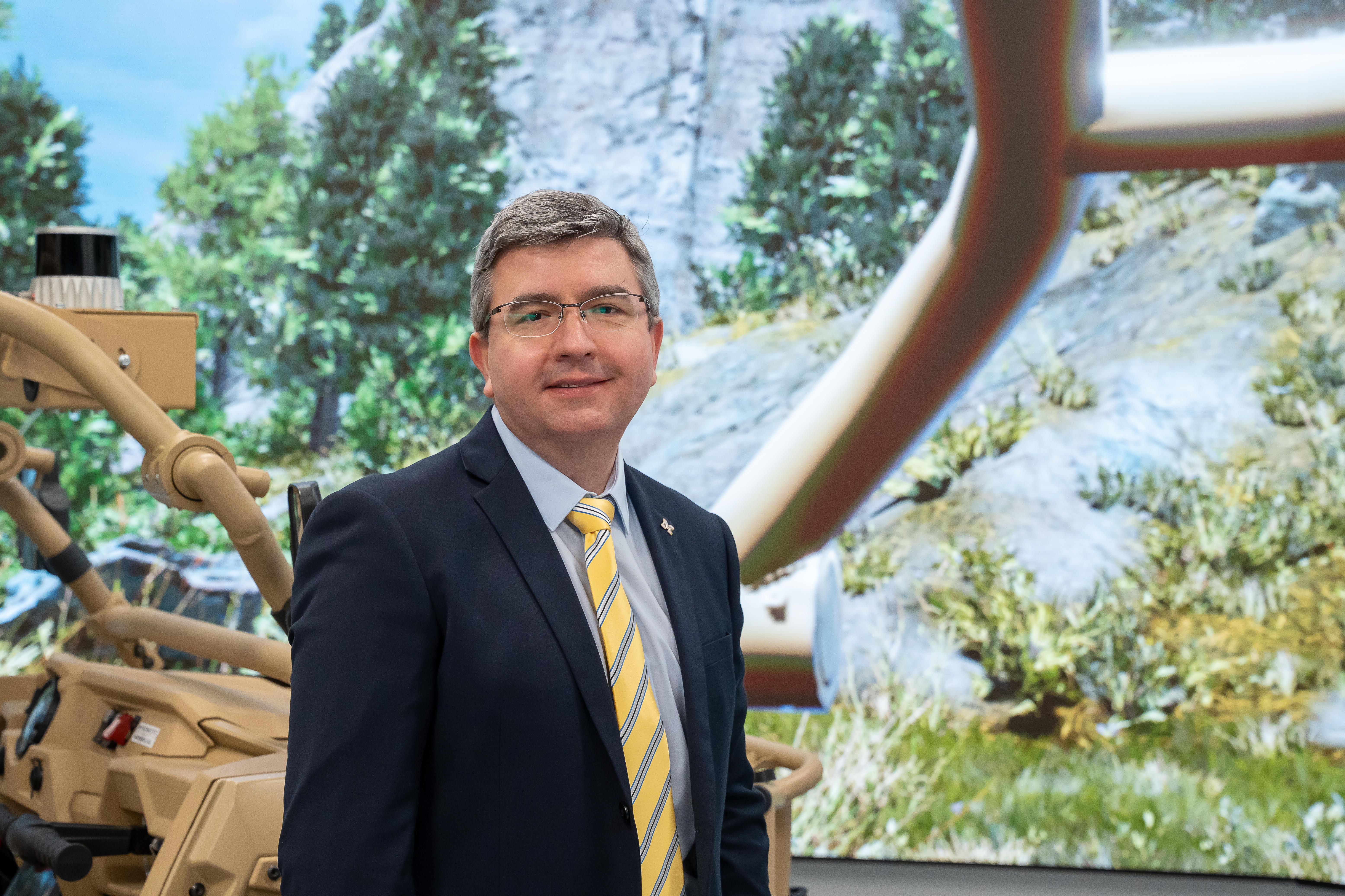 Prof. Epureanu in the ARC Autonomy Lab, demostrating its immersive virtual reality capabilities.